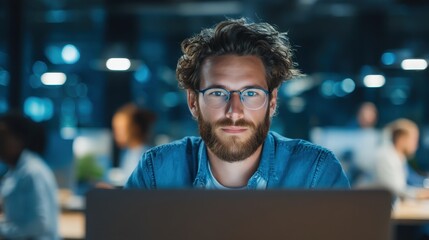 Laptop work in modern office setting with focused professional