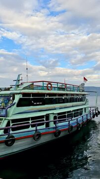 Local charter boats for inter-island crossings on Lake Toba carrying tourists, passengers and cargo. The ship travels from Parapat to the island of Samosir.