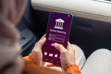 A woman using smartphone to access online mobile banking. Enter username and password to access mobile banking.