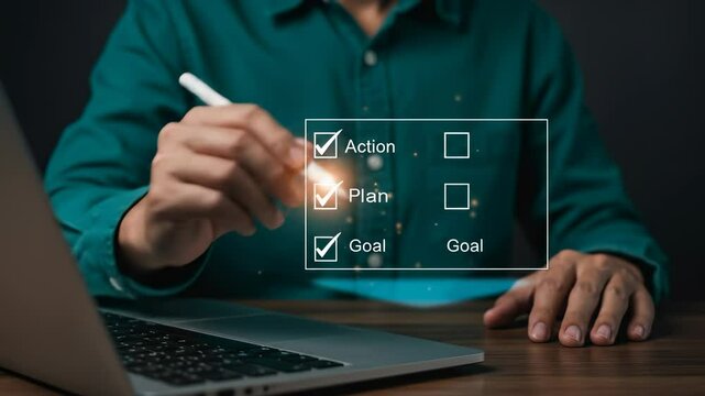 Goal Setting & Action Planning: Man Checking off Digital Checklist with Stylus & Laptop for Business Success