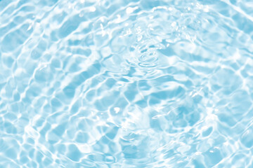 Blue water with ripples on the surface. Defocus blurred transparent blue colored clear calm water...