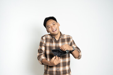 Asian man in a plaid shirt poses playfully with an open wallet, expressing a lighthearted moment. Perfect for concepts of humor, emotions, or finance illustration.