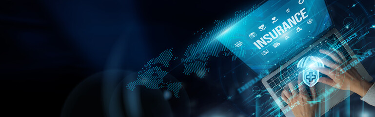 Businessmen use laptops to manage insurance policies, track claims, analyze risks, and ensure...