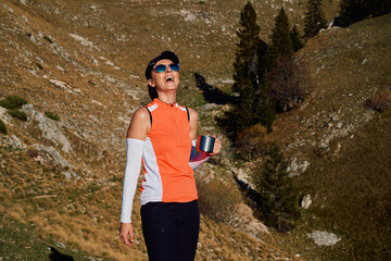 Female Hiker Preparing for a Climb to Conquer a Mountain Peak.