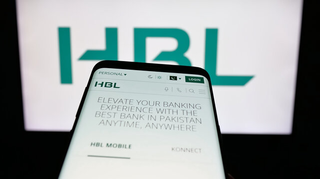 Stuttgart, Germany - 06-25-2025: Mobile phone with website of Pakistani company Habib Bank Limited (HBL) on screen in front of logo. Focus on top-left of phone display.