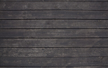 Obraz premium Dark background of wooden planks