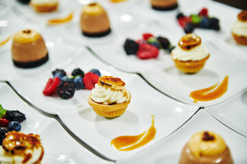 Gourmet desserts being prepared in a commercial kitchen