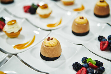Gourmet desserts being prepared in a commercial kitchen