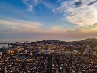 High-angle drone view of Durrës, Albania, captured during golden hour at sunset. 