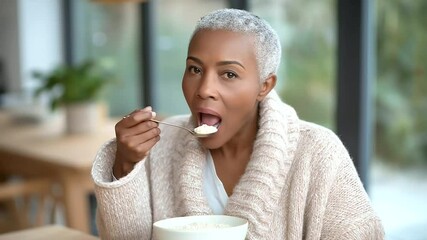 Caregiver Assisting with Meal in Warm Dining Room Setting