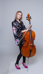Woman with Cello, Bow, and Floral Robe on White Background