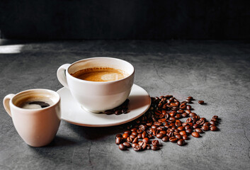 Espresso coffee cup with Americano coffee shot and roasted coffee beans on gray background