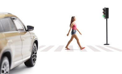 Full length profile shot of a female teenager crossing street