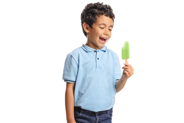 Excited boy holding ice cream lollie and smiling