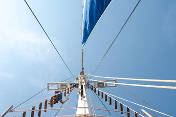 A captivating point-of-view shot capturing the view of the majestic Phinisi sail from onboard. The...