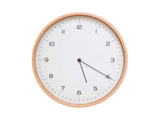 Minimal wall clock with light wood frame and white face displaying 05:20 or 17:20. Perfect for clean, modern concepts about time and scheduling.