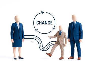 Group of faceless mannequins dressed business suits standing front of change concept diagram with arrows and winding path, symbolizing leadership and transformation, conveying sense of progress