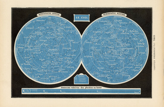 Munich, Germany - June 27, 2025:: colorful blue and black printed vintage French map or chart of the sky with northern and southern hemisphere and zodiac signs, planets and stars, old astronomy 