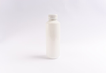 white plastic bottle with a twist cap on a white background