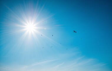 A blue sky with hot sun light