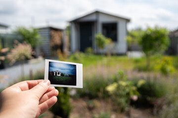 Nostalgic snapshot connects a memory to a blossoming garden in a serene backyard setting during a...