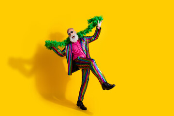 Photo of good mood pensioner wear stylish striped bright outfit have fun isolated on yellow color...