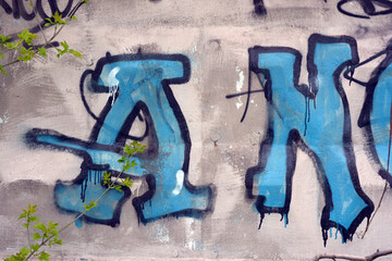 A bright inscription consisting of blue letters with white dots, black lines, and black borders. A...