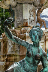 Innsbruck, Austria - June 6th 2025 - Captivating detail of an ancient statue in an Innsbruck...