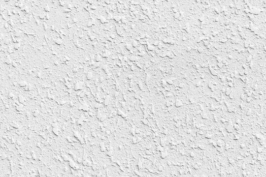 Detailed close-up seamless photo of a white textured decorative stucco wall