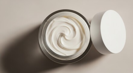 Close up of a jar of white facial cream with its lid off