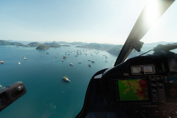 An incredible aerial perspective of Labuan Bajo captured from a helicopter, sitting beside the...