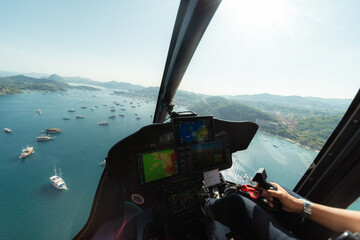 An incredible aerial perspective of Labuan Bajo captured from a helicopter, sitting beside the...