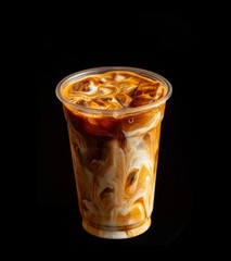 Close-up of caramel iced latte in a transparent cup showcasing swirling coffee texture blending with creamy milk, condensation droplets on the glass surface, commercial product photography