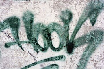 Drawings, graffiti, inscriptions on an old reinforced concrete fence, brick walls. Unusual text,...