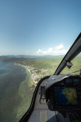 An incredible aerial perspective of Labuan Bajo captured from a helicopter, sitting beside the...