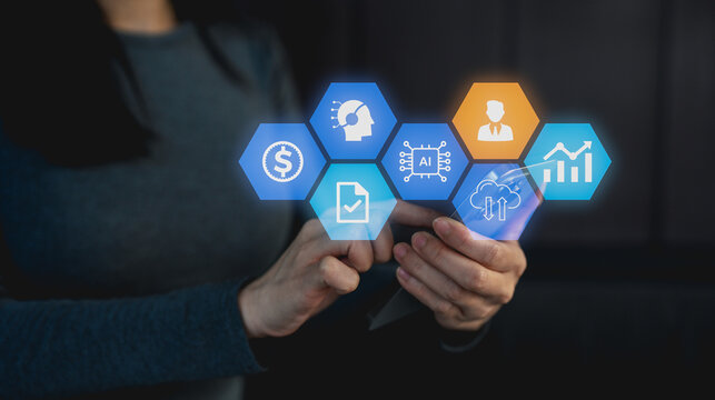 A person interacts with digital icons representing AI, finance, data analysis, and business using a smartphone in a dark environment.