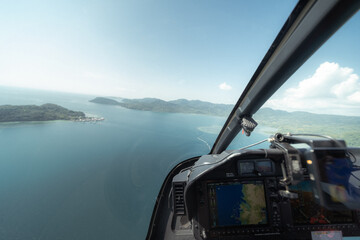 An incredible aerial perspective of Labuan Bajo captured from a helicopter, sitting beside the...