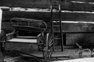 A vintage wagon nestled in the rustic setting of Black Creek Pioneer Village, Toronto.