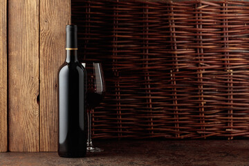 Bottle of red wine on a vintage background.