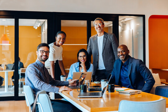 Professional team discussing ideas during a meeting in a bright office space