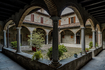 Historic Stone Monastery With Inner Courtyard And Arched Walkways: Peaceful Cloister Architecture In Northern Italy