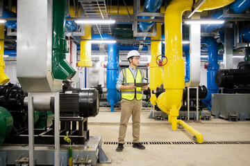 asian male engineer is working on a Cooling system pipeline
