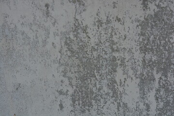 Original background, building materials, gray cement walls covered with light brush strokes with white paint.