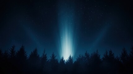 A bright, light beam ascends above a dark forest at night