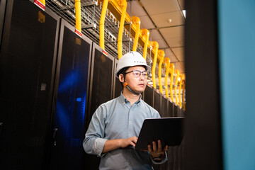  asian network engineer working in data center
