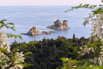 Scenic view of Saint Nedelja islets surrounded by Adriatic Sea near Montenegro coastline framed by...