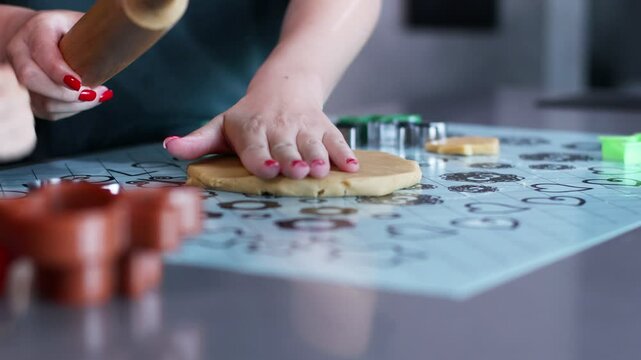 Mother and son bond over making gingerbread in their stylish kitchen.