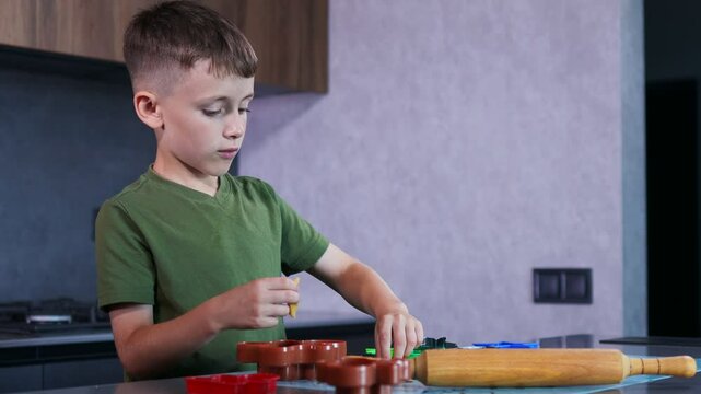 A focused child joyfully bakes colorful cookies with fun cutters and soft dough in a warm, creative kitchen.