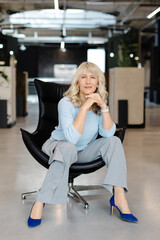 Confident Woman in Modern Office Setting Portrait
