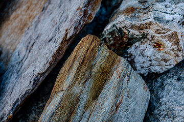 Textured Rock Surface With Layers Of Striated Minerals: Close-Up Of Weathered Geological Formation...